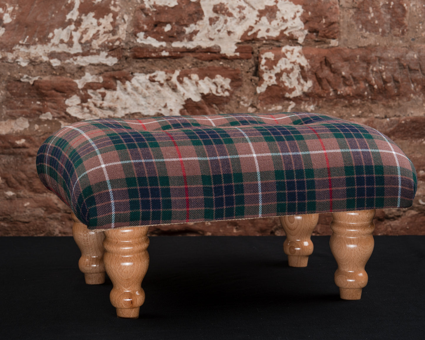 This footstool is a well-crafted, classic piece with strong Scottish heritage, perfect for customers seeking quality and tradition in their decor. The Fraser Hunting tartan and traditional feet make it a timeless choice.